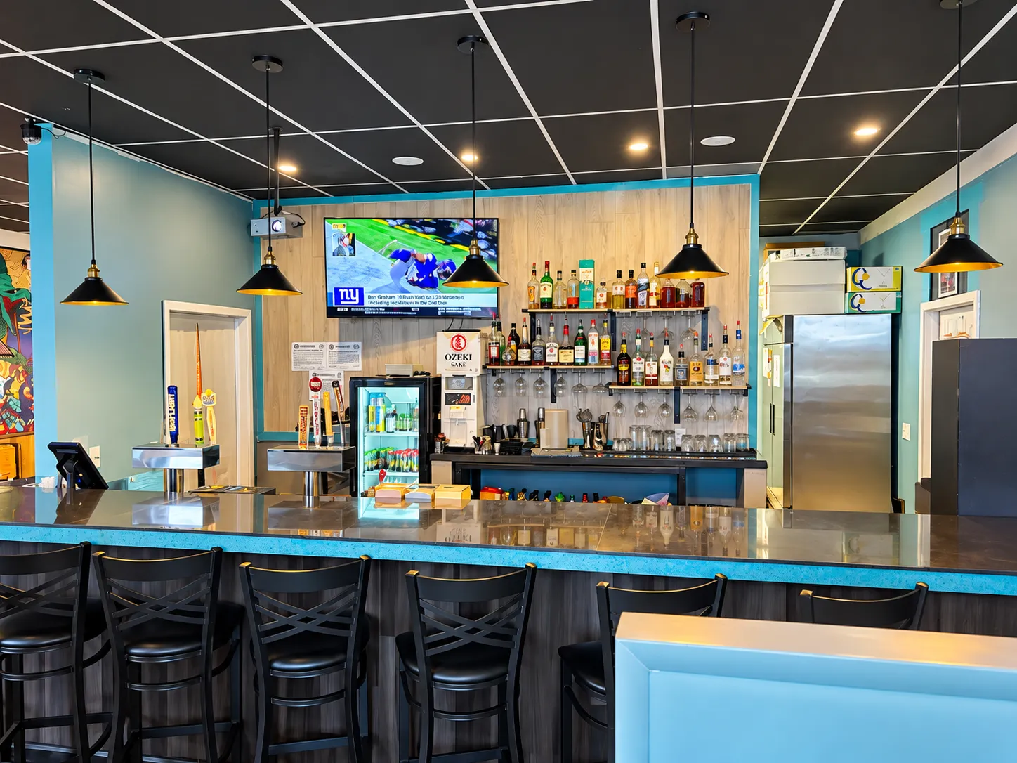 Full bar with taps and spirits at Tougen